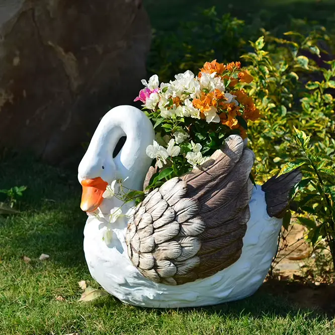 Statue de fontaine d'oie de jardin
